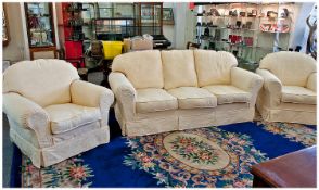 Classic Three Piece Suite, upholstered in cream floral patterned fabric, comprising three seater