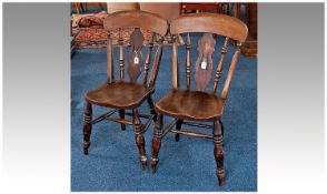 Pair of Mid 19th Century Kitchen Chairs, of regional design, each with large crest rail, raised on