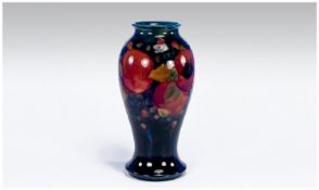 William Moorcroft Signed Vase. Pomegranate and berries design on blue ground. Circa 1920/1925