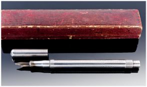 A Silver Fountain Pen. Fine engine turned barrel and cap and 14ct gold nib. Apparently unmarked.