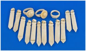 A Set of Twelve Ivory Markers. Each carved with an elephant at the finial. Also three ivory rings