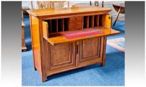 Early 20th Century Oak Secretaire, with moulded top, the panelled front opening out and folding