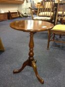 Small Mahogany Tripod Table, with a circular top, raised on a baluster column and three cabriole