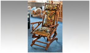 Late 19th / Early 20th Century Mahogany Rocking Chair, upholstered with fabric in the manner of