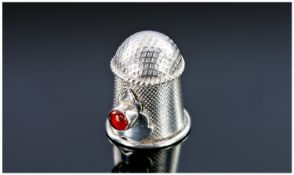 An Unusual Sterling Silver & Gem Set Thimble. Domed top above a rope twist border. The main double