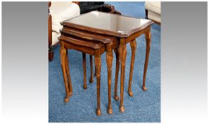 Nest of Three Tables, raised on cabriole legs, largest measuring 22 inches high, 21 wide and 16