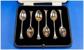 A Boxed Set Of Six Silver Teaspoons, scroll tops. Hallmark London 1917.