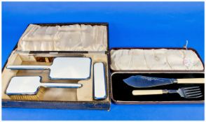 Art Deco Silver And Enamelled Dressing Table Set, Comprising Hand Mirror And Two Brushes, All Backed