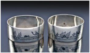 A Pair of Egyptian Silver and Niello Napkin Rings. Finely decorated with scenes of Feluccas in