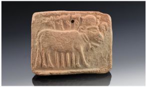 A Rare Egyptian Terracotta Pendant/Plaque Of The Apis Bull. The sacred bull proceeding with the