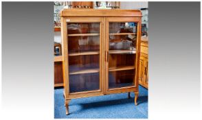Early 20th Century Oak Bookcase, moulded top, with glazed doors opening to reveal adjustable