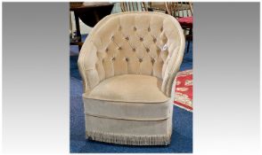 Modern Upholstered Tub Chair, upholstered in cream, buttoned back, fringed edge, raised on
