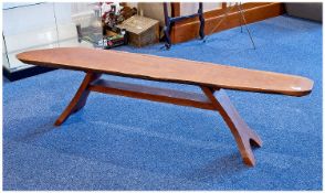 Contemporary Naturalistic Teak Coffee Table, the top made from one piece of teak, taken from the