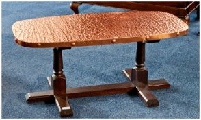 Copper Covered Coffee Table, planished top, raised on turned legs, trestle type base, measuring 15
