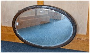 Early 20th Century Oak Framed Mirror, fitted with bevelled edge glass, 32½ inches high and 22½