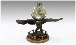 Large Glass Bubble Clock on winged eagle base.