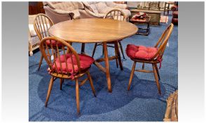Ercol Ash Topped Dining Table and Four Hoop Back Chairs, the dining table of drop leaf form with a