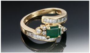 18ct Gold Emerald & Diamond Ring, The centre Emerald flanked by six small diamonds with a further 30