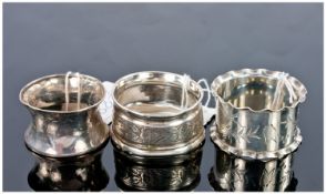 Three Silver Napkin Rings, Hallmarked for Birmingham, London and a further one. Hallmarks worn.