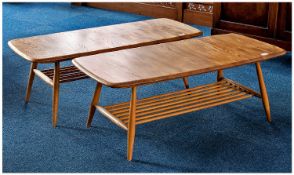 Pair of Ercol Elm Topped Coffee Tables, of oblong form, raised on turned legs, each united by a rack