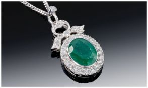 Ladies 18ct White Gold Set with Oval Faceted Emerald surrounded by all diamonds attached to a 9ct