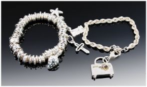 A Silver Links Bracelet Loaded With 4 Charms. 74.6 grams. Plus a silver rope chain with handbag