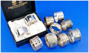 Bag Containing A Collection Of Silver Plated Nakpin Rings, together with a boxed pair.