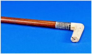 Victorian Ivory and Silver Handle Walking Stick. 31 inches long.