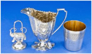 Three Interesting Silver Plated Items 1.A Victorian Helmet Shaped milk or sauce vessel on a pedestal