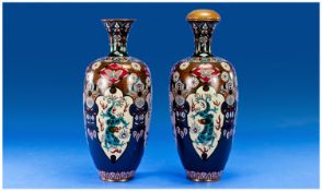 Pair of Cloisonne Ovoid Vases with flared necks, each profusely decorated with a plethora of