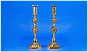 Pair of Victorian Style Brass Candlesticks, each measuring 12 inches high.