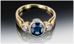 Ladies 18ct Gold 3 Stone Diamond and Sapphire Ring. Comprising centre blue Sapphire in white gold