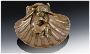 Bronze Style Shell containing nude boy.