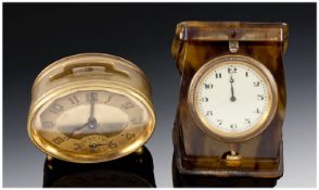 Art Deco Brass Alarm Clock, with an oval dial, Arabic numerals with matching subsidiary dial for the