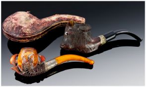 Meerschaum Pipes (2) in total. A. The bowl carved in wood and in  the form of a Buffalo head,