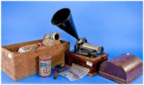 An Edison Gem phonograph with Thomas A. Edison trade mark, oak base and cover, horn and a