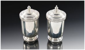 A Fine 1960`s Silver Pair Of Salt & Pepper Pots, Each 2.5`` in height. Makers mark J.R. Hallmark