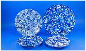 Three Various Spanish Faience Plates, hand painted blue on white, 2 with repeated floral patterns,
