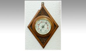 Osbert Henderson Glasgow Carved Oak Circular Aneroid Barometer, of good quality. 18.5`` in height.