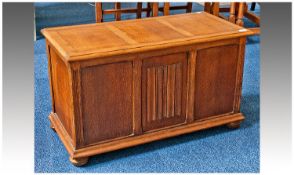 Early 20th Century Oak Chest, lidded top opening to reveal storage section, the centre panel to