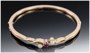 15ct Gold Late Victorian Hinged Bangle, Set With A Central Ruby Between Two Diamonds (Approx .40ct),