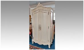 Contemporary Cream Painted Armoire, the shaped top with leaf pediment, foliage cornice, with