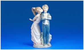 Lladro Figure `Kiss Please` Model number 5555. 8`` in height.