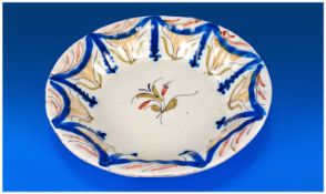 Faience Shallow Dish, naively hand painted central sprig of flowers, bordered to the raised edge