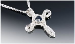 9ct White Gold Diamond Set Cross Pendant, With Central Floating Diamond. Suspended On A Fine Link