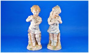 Pair of Reproduction Heubach Style Bisque Figures, young girl in blue spotted shift and striped