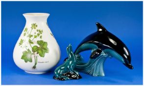 Poole Pottery, Three Items Comprising A Vase, Dolphin And Sea Lion.