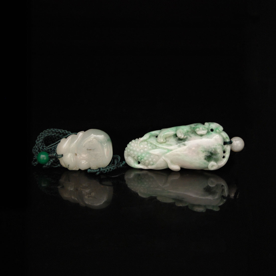 ????????:????,????  Two Jadeite Pendants: Corn with Ruyi, Qilin and Rabbit Length: 1? in.(3.5 cm.)