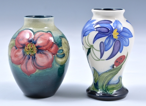 A small Moorcroft pottery ovoid vase, Clematis design on a blue-green ground, impressed marks,