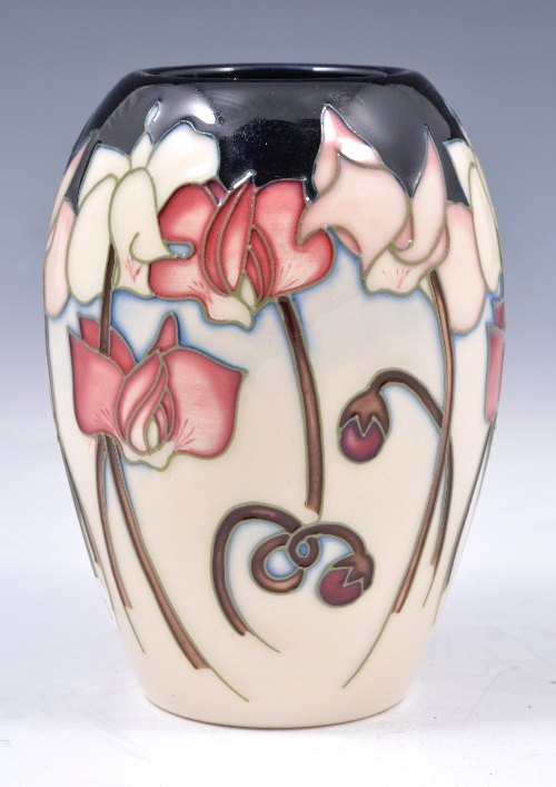 A Moorcroft pottery ovoid vase, spring flowers on a blue-ivory coloured ground, impressed marks